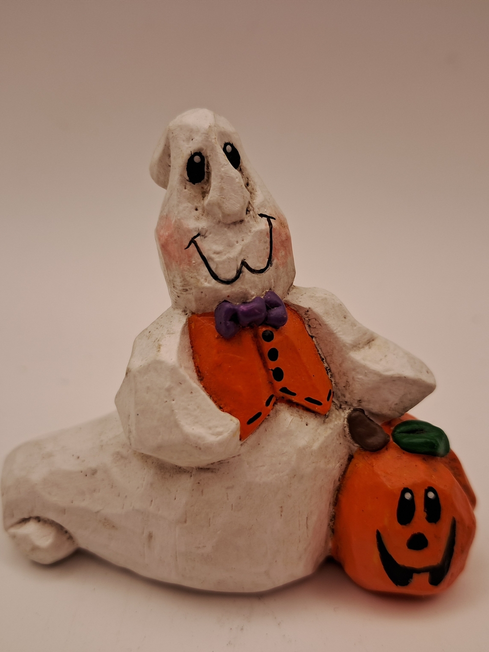 White Ghost Halloween Figurine with Orange Pumpkin and Purple Bow